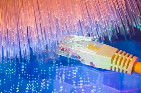 Network cables with fiber optic background Stock Photos