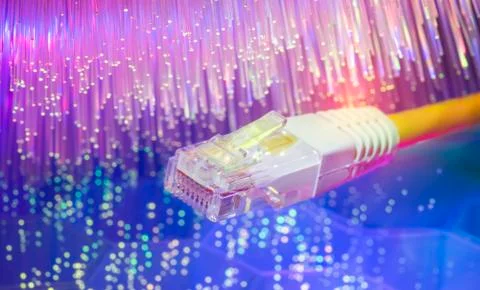 Network cables with fiber optic background Stock Photos