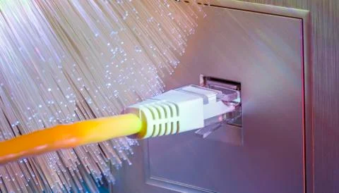 Network cables with fiber optic background Stock Photos