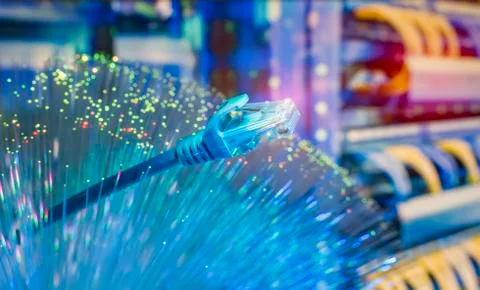Network cables with fiber optical background Stock Photos