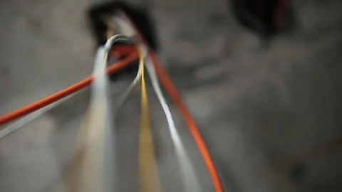 Network cables hanging from ceiling opening Stock Footage 326825021