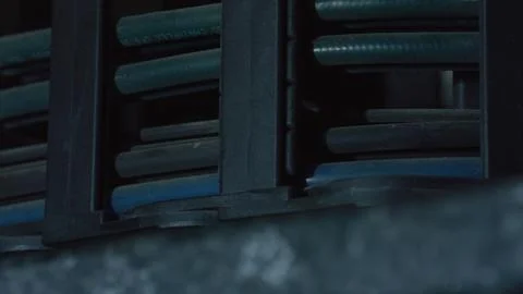 Network cables organized on server rack in data center Stock Photos