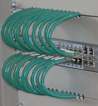 Network cables in a patch panel for the connection of the computer Stock Photos