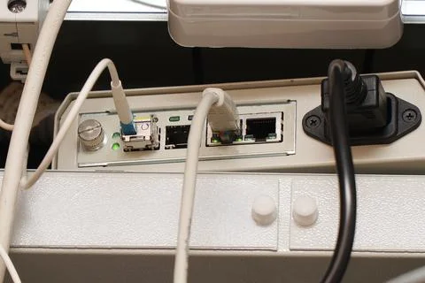 Network computer cables connected to a router or modem in office Stock Photos