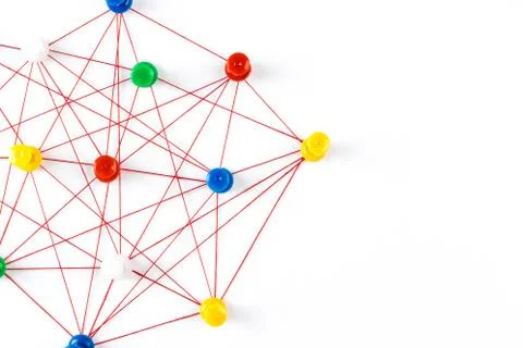 Network connection made from push pins and thread on blue background, close-u Stock Photos