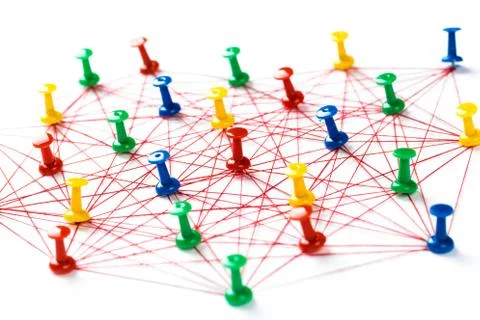 Network connection made from push pins and thread on blue background, close-u Stock Photos