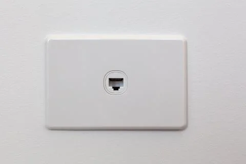 Network connection wall outlet on white wall with copy space Stock Photos