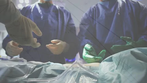 Network of connections against mid section of surgeons performing operation in Stock Footage 329288526