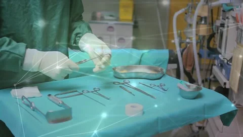 Network of connections against mid section of surgeon inspecting medical Stock Footage 330731626