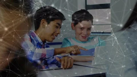 Network of connections against two diverse boys using digital tablet in the Stock Footage 329774828