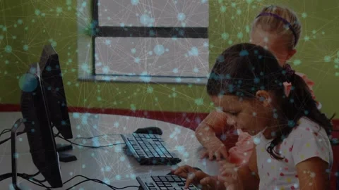 Network of connections floating over two diverse girls using computer at school Stock Footage 328979854