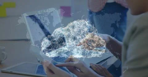 Network of connections forming a cloud over world map against woman using 库存照片