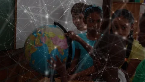 Network of connections over diverse students learning geography using a globe at Stockbeeldmateriaal 330585987