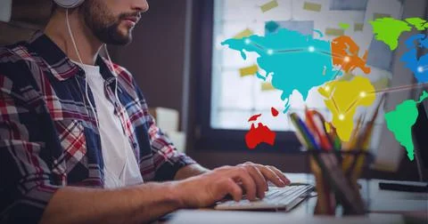 Network of connections over world map against mid section of man using computer Foto stock