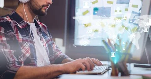 Network of connections over world map against mid section of man using computer Foto stock