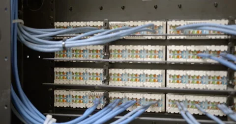 Network connections on the punch down block in COMM closet Stock Footage 137920708