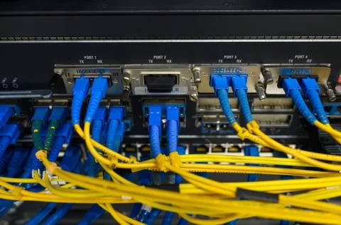 Network core switch front panel with fiber optics patch cord connected Foto stock