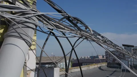 Network Data Cables and Telecom Wires Stretching Across City Rooftop Stock Footage 347537245