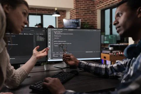Network developers updating firewall system through information processing using Stock Photos