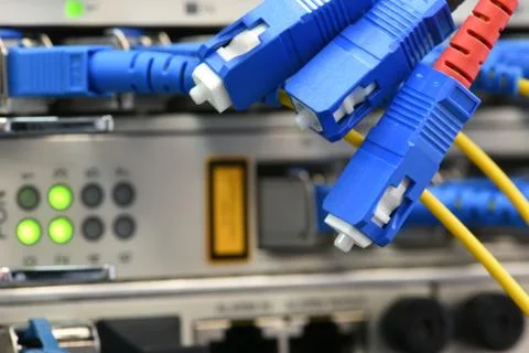 Network devices and optical cables in telecommunication system Foto stock