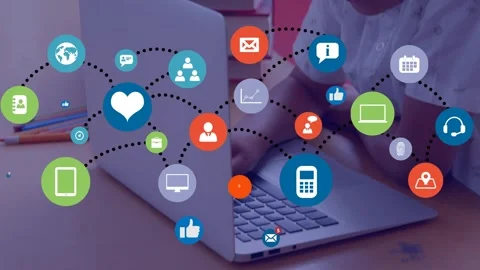 Network of digital icons against hispanic boy using laptop in the class at Stock Footage 329698225