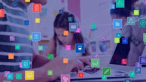Network of digital icons against mid section of a boy using laptop in the class Stock Footage 326191522