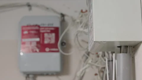 Network Distribution Boxes with Internet Cables Mounted on Wall in Building Stock Footage 330090416