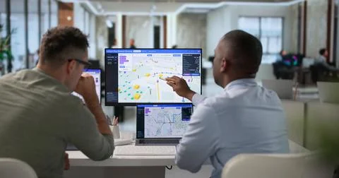 Network Engineer And Technician Review Fiber Optic Route Mapping Carefully. Stock Photos