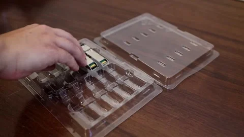 Network engineer arranging optical transceiver modules Video stock 282984173