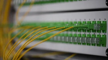Network engineer crossing optical patch cord on in data center Stock Footage 86111946
