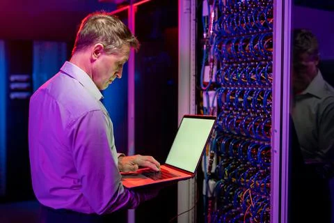 Network engineer diagnosing server problems Stock Photos