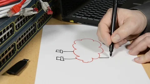 Network engineer drawing a plan which shows Cloud Computing Stock Footage 73552706
