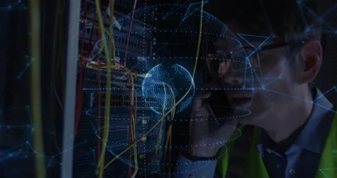 Network engineer entering datacenter adjusting cables holding phone and studying Stock Footage 311455854