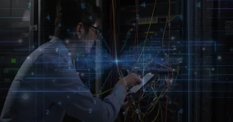 Network engineer handling tablet while managing cables, showing glowing data Stock Footage 309255584