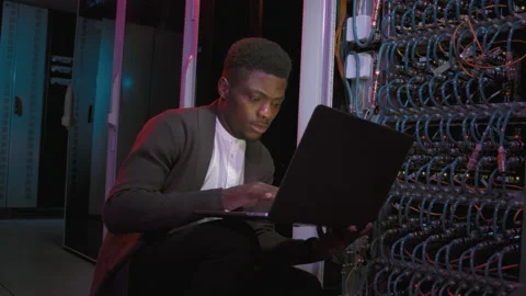 Network Engineer with Laptop in Data Center Stock Footage 155247376