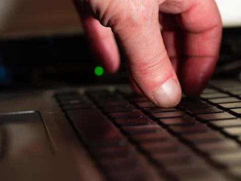 Network engineer with laptop with ethernet switch port lights Stock Photos