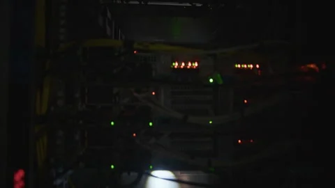 Network Engineer Opening Server Rack and Inspecting Hardware with Flashlight Stock Footage 330543070