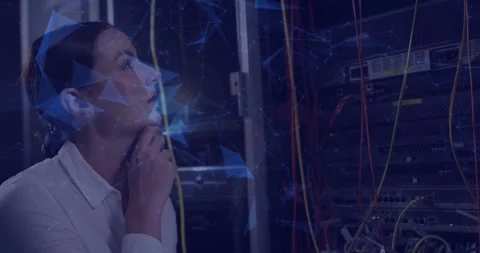Network engineer raising hand to chin, engaging holographic overlay while Stock Footage 326101264