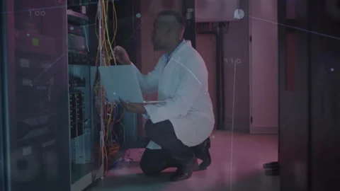 Network engineer reviewing logs then plugging yellow cable with data overlay Stock Footage 311141648