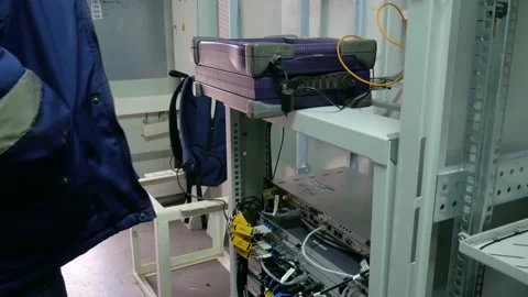 Network engineer in server room with optical patchcord. Stock Footage 151077414