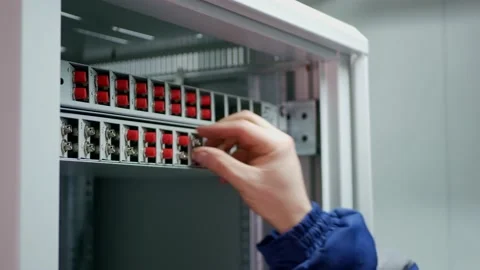 Network engineer in server room with optical patchcord. Stock Footage 151078661