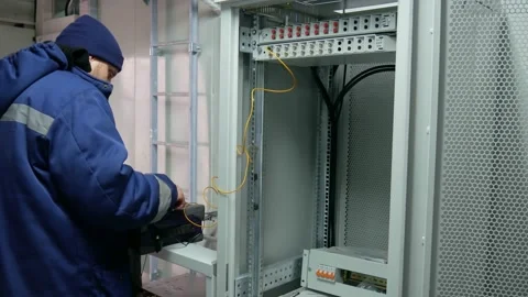Network engineer in server room with optical patchcord. Stock Footage 151078830