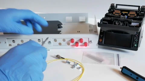 Network engineer in server room works with optical patchcord Stock Footage 91074335