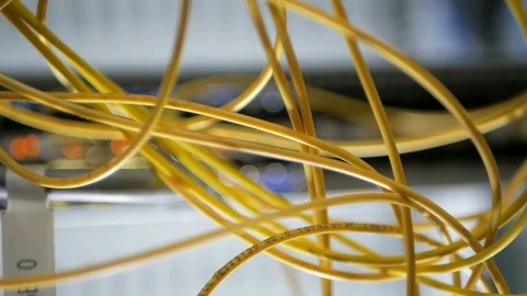 Network engineer in server room works with optical patchcord and optical module. Stock Footage 126949435