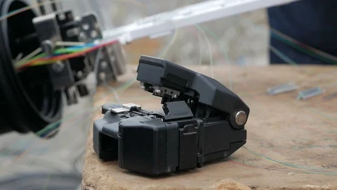 Network engineer in server room works with optical patchcord and optical module. Stock Footage 126951105