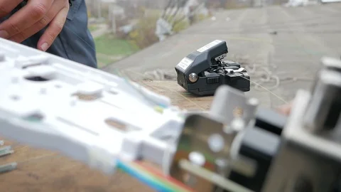 Network engineer in server room works with optical patchcord and optical module. Stock Footage 126951242