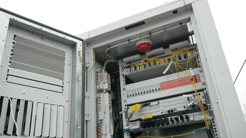 Network engineer in server room works with optical patchcord and optical module. Stock Footage 126951480