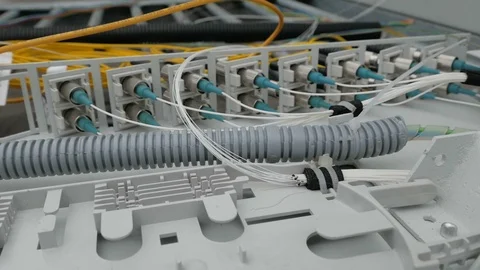 Network engineer in server room works with optical patchcord and optical module. Stock Footage 126954751