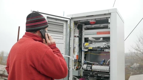 Network engineer in server room works with optical patchcord and optical module. Stock Footage 126987821
