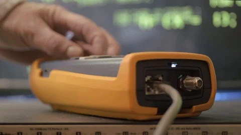 Network engineer testing Ethernet connections with network testing Stock Footage 120396605